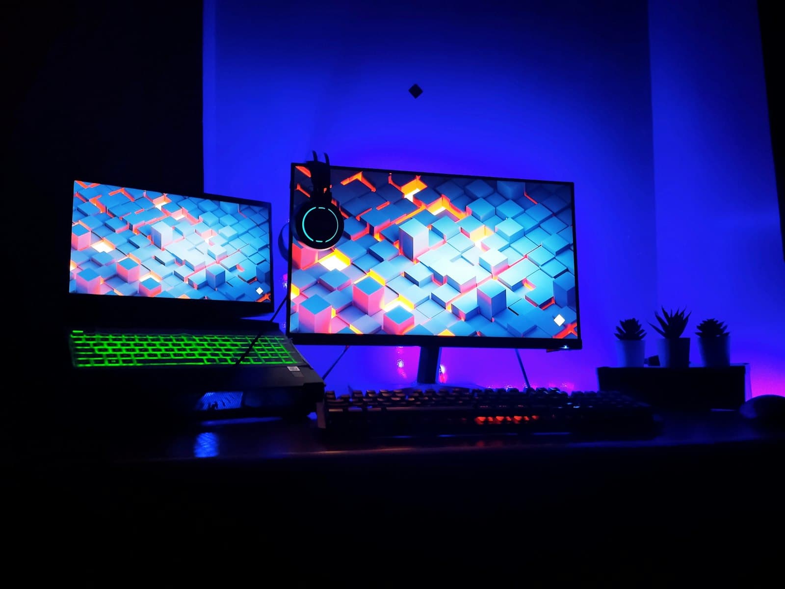 A dual monitor gaming setup — peripherals like monitors, keyboards, and mice are separate from your PC build budget