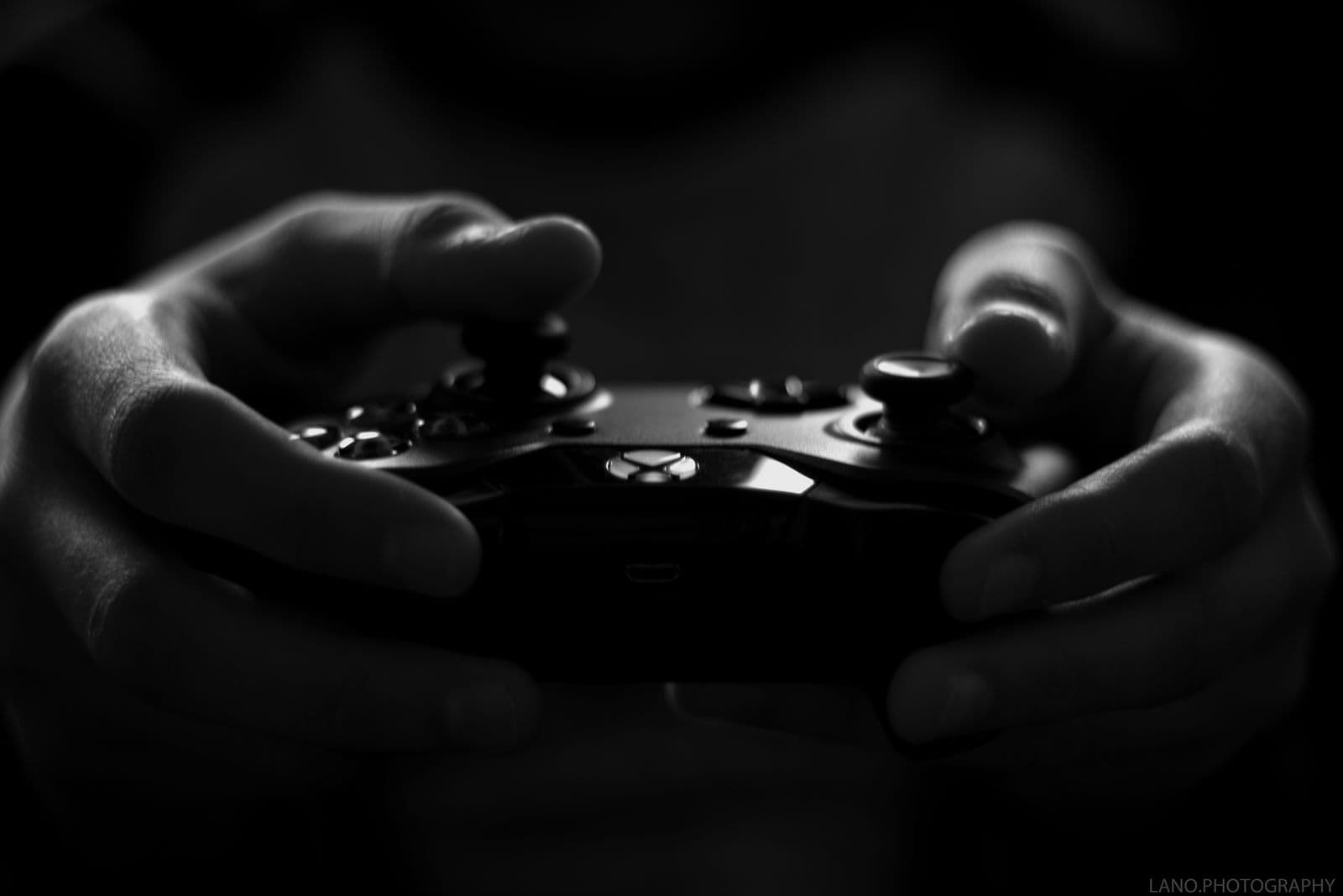 Close-up of hands holding a game controller, the console-first experience GTA 6 is currently built for