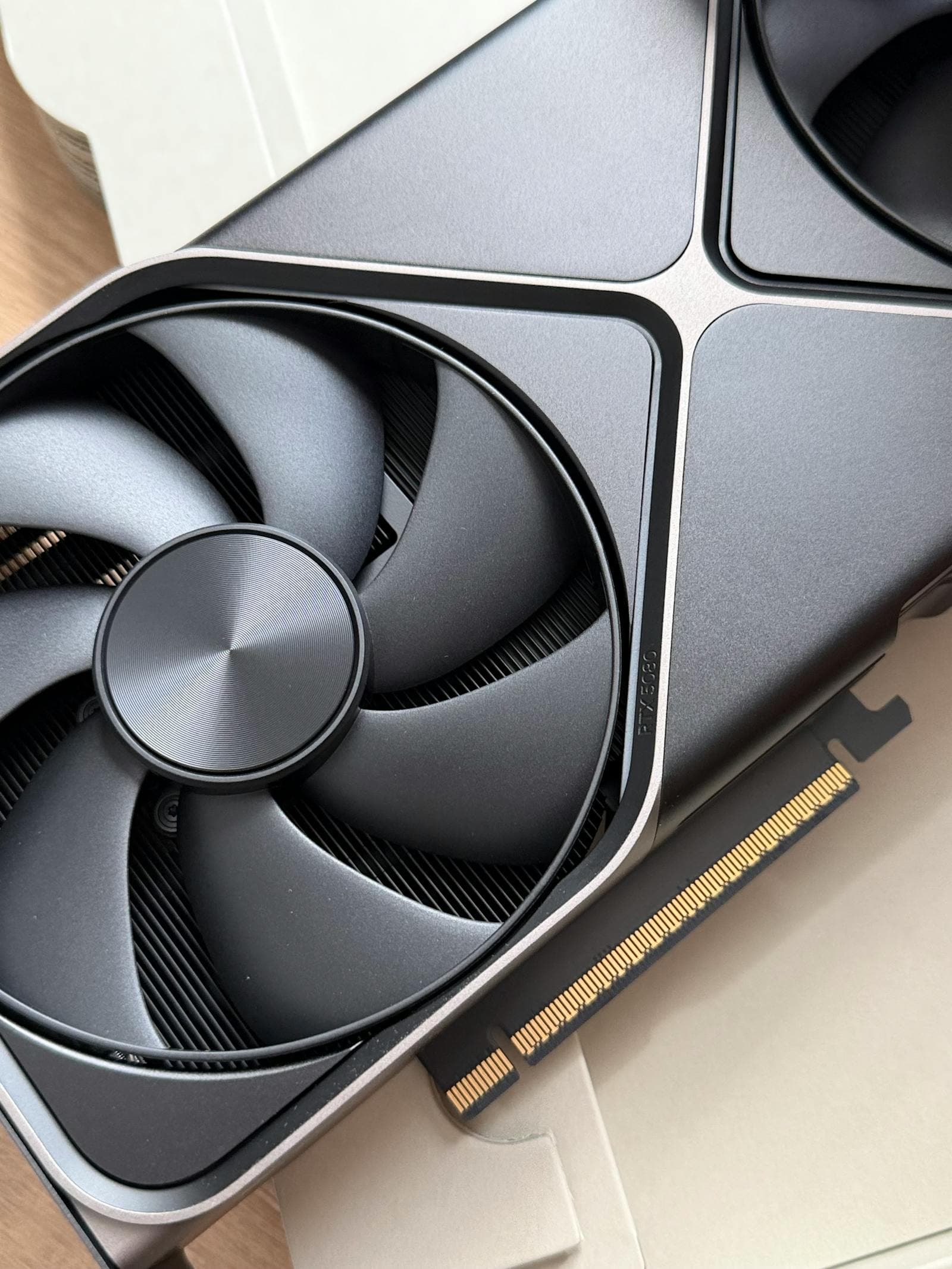 Close-up of a GPU cooling fan — the $300 graphics card tier in 2026 spans everything from the Arc B580's 12GB VRAM to the RX 7600's strong 1080p value