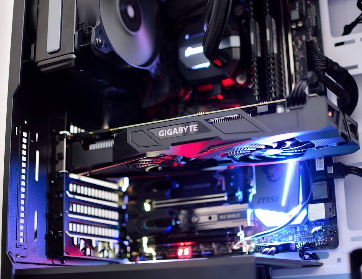 Multiple graphics cards lined up on a surface — the used GPU market is where the $200 budget becomes genuinely capable for 1080p gaming in 2026