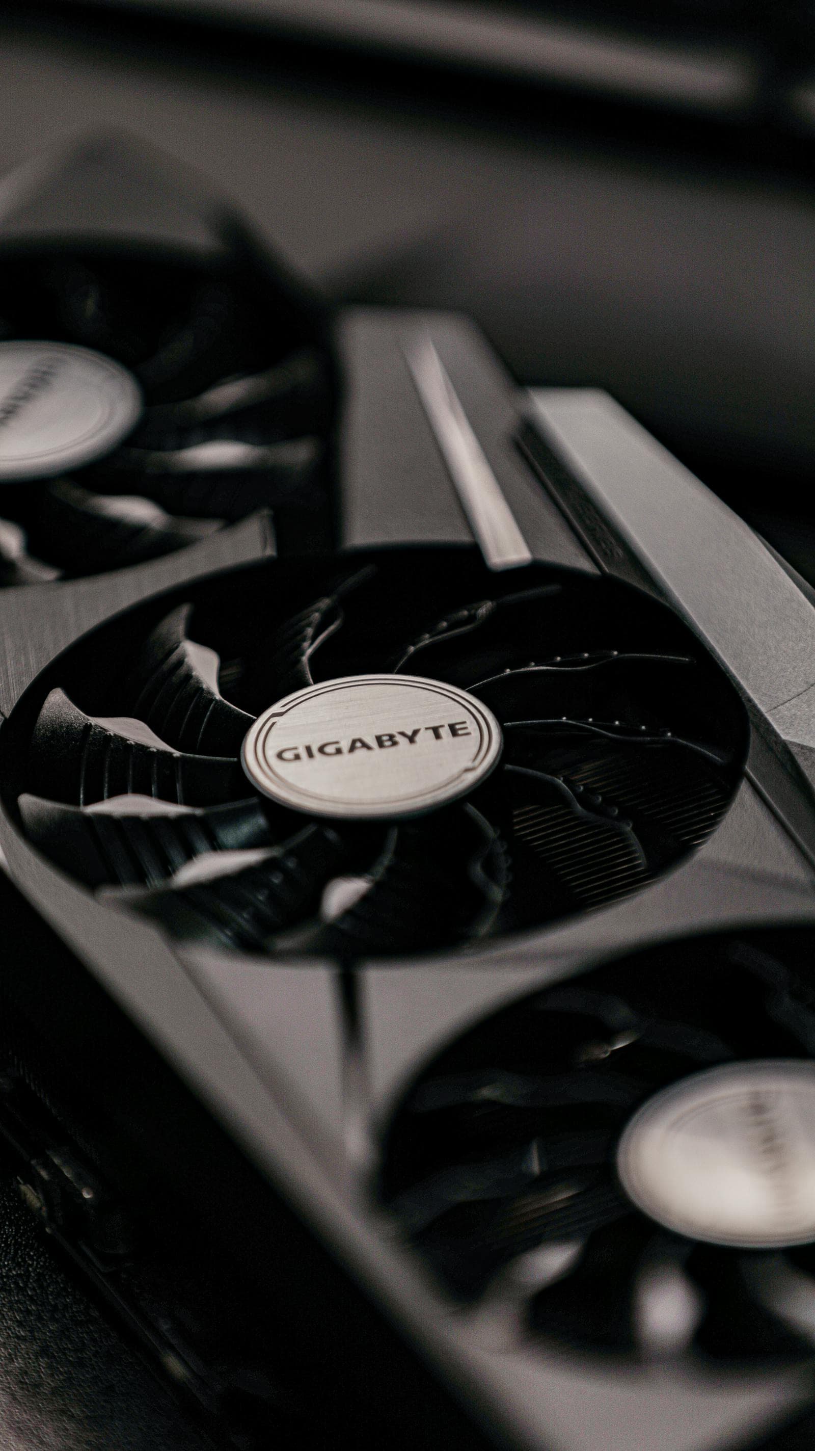 Multiple graphics cards on a table — at the budget tier under $270, the RX 7600 and Arc B570 are the two primary options for 1080p gaming
