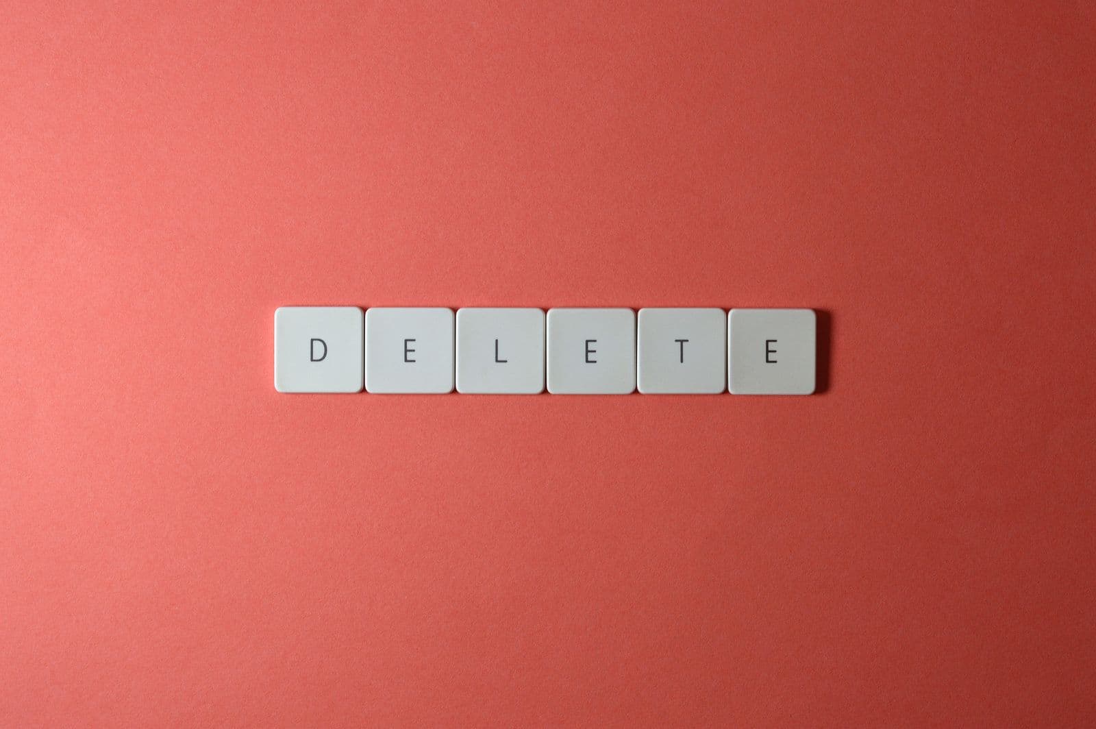 Close-up of white keycap tiles spelling DELETE, the key that opens BIOS on MSI, Gigabyte, ASRock, and ASUS boards