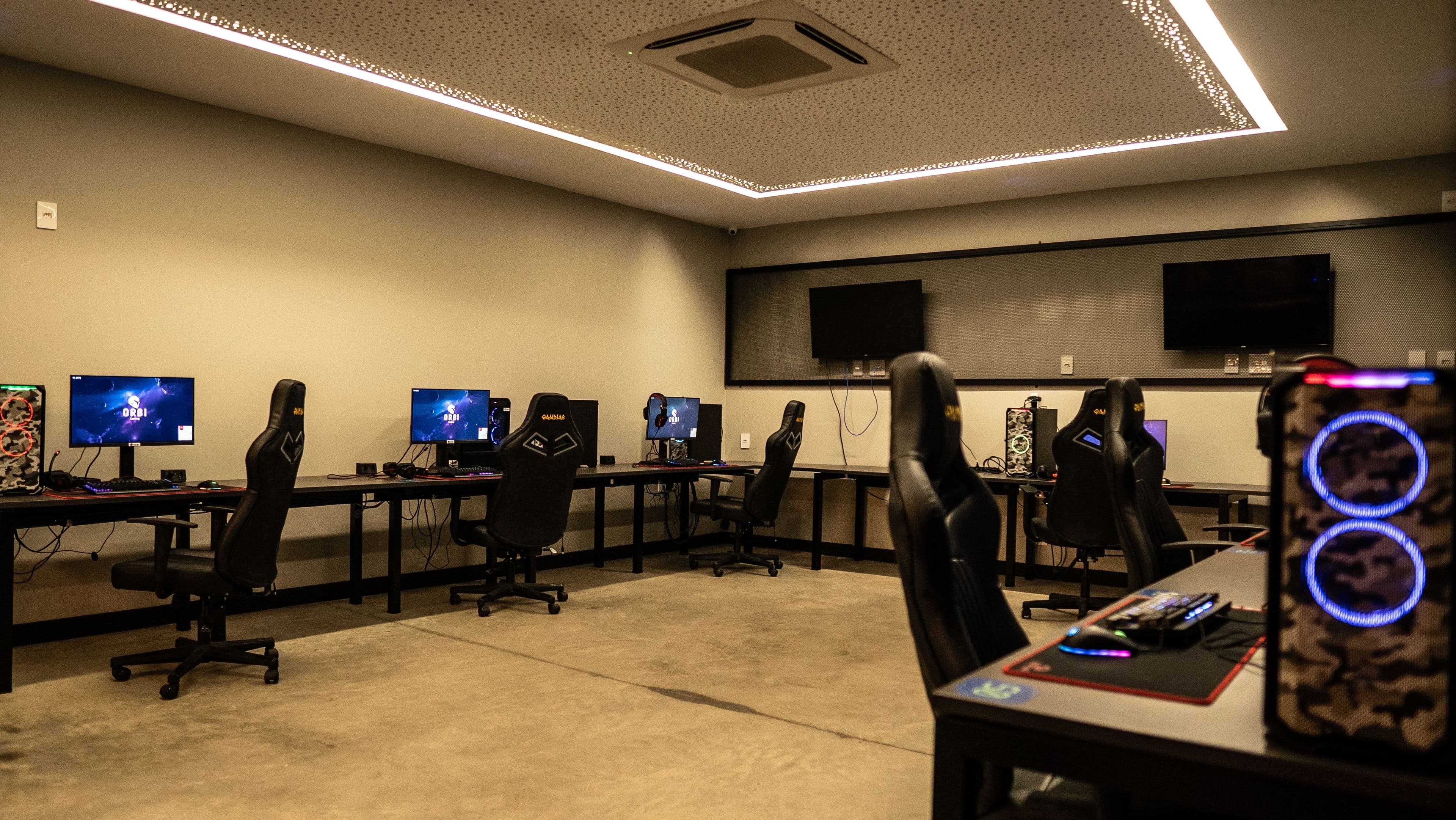 A gaming computer setup with RGB lighting in a dark room, showing the kind of high-end build that handles Minecraft ray tracing shaders