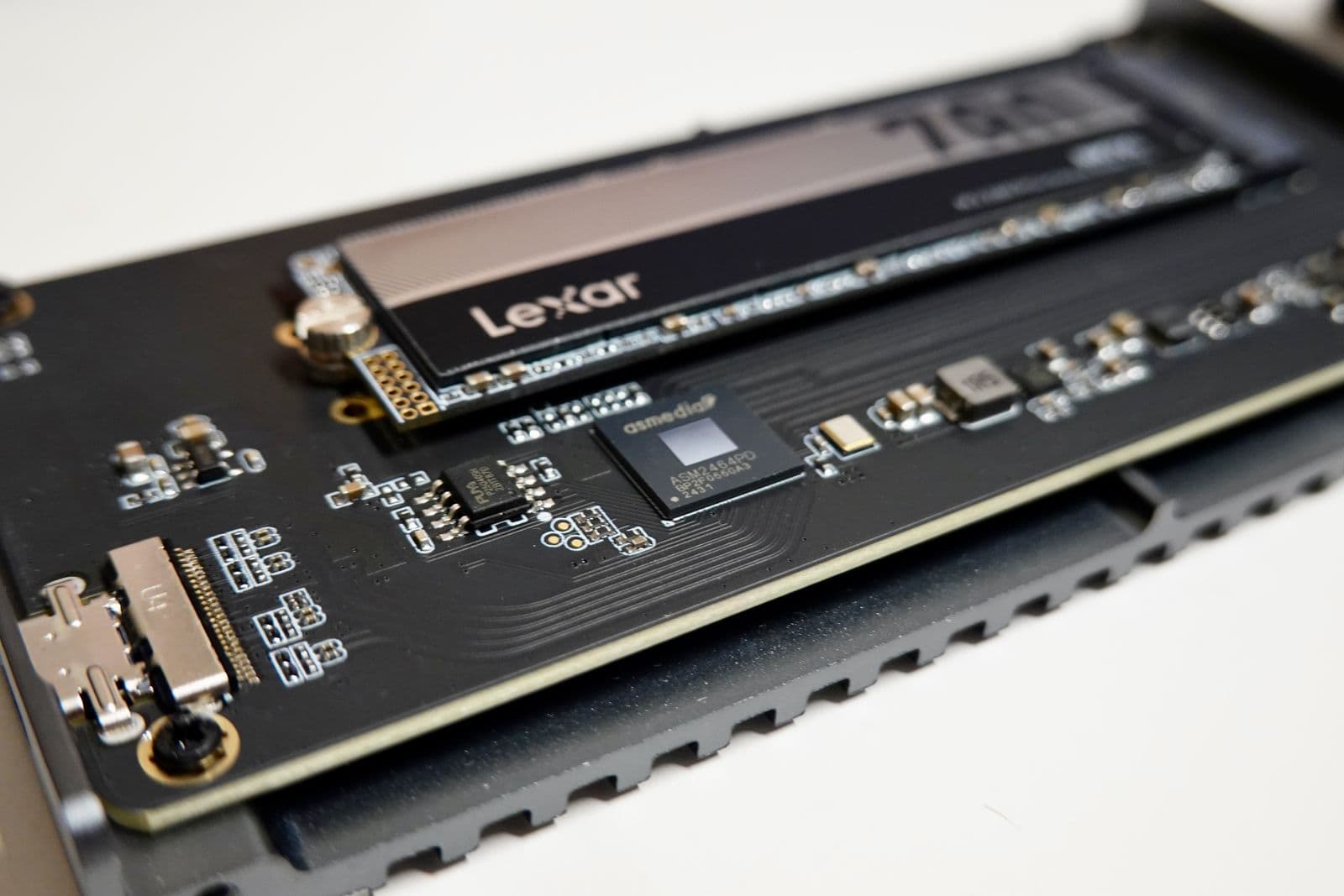 Close-up of an NVMe M.2 SSD seated in a motherboard slot, showing the compact stick-shaped form factor used for modern gaming storage