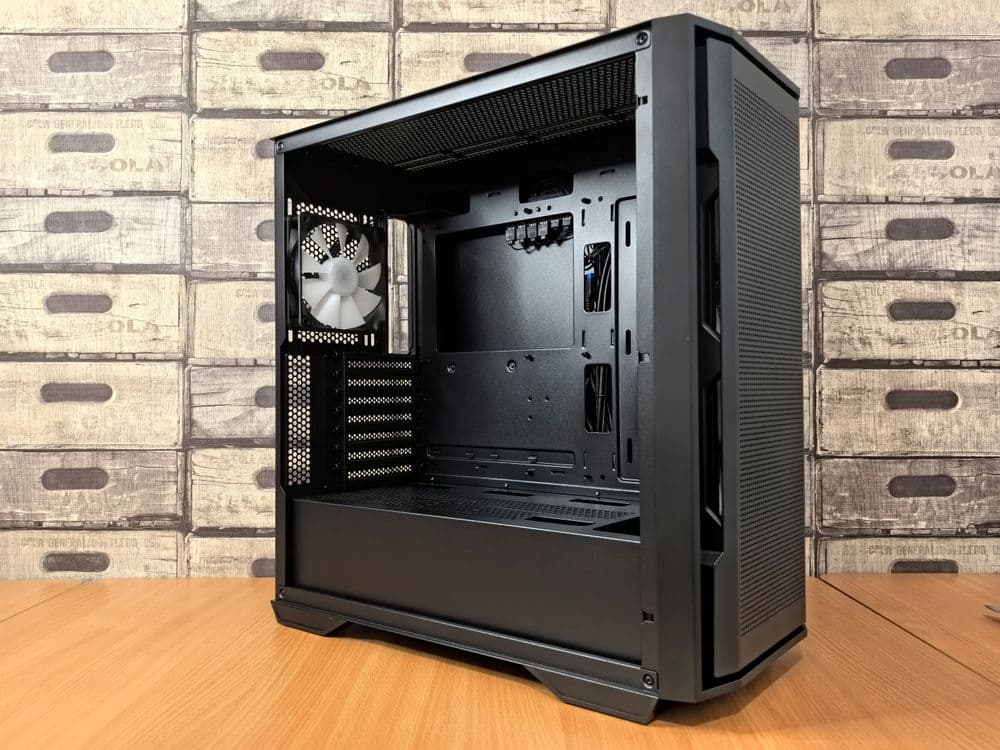 A PC case with a fan mounted in the front position, illustrating intake airflow path through a mesh or perforated front panel