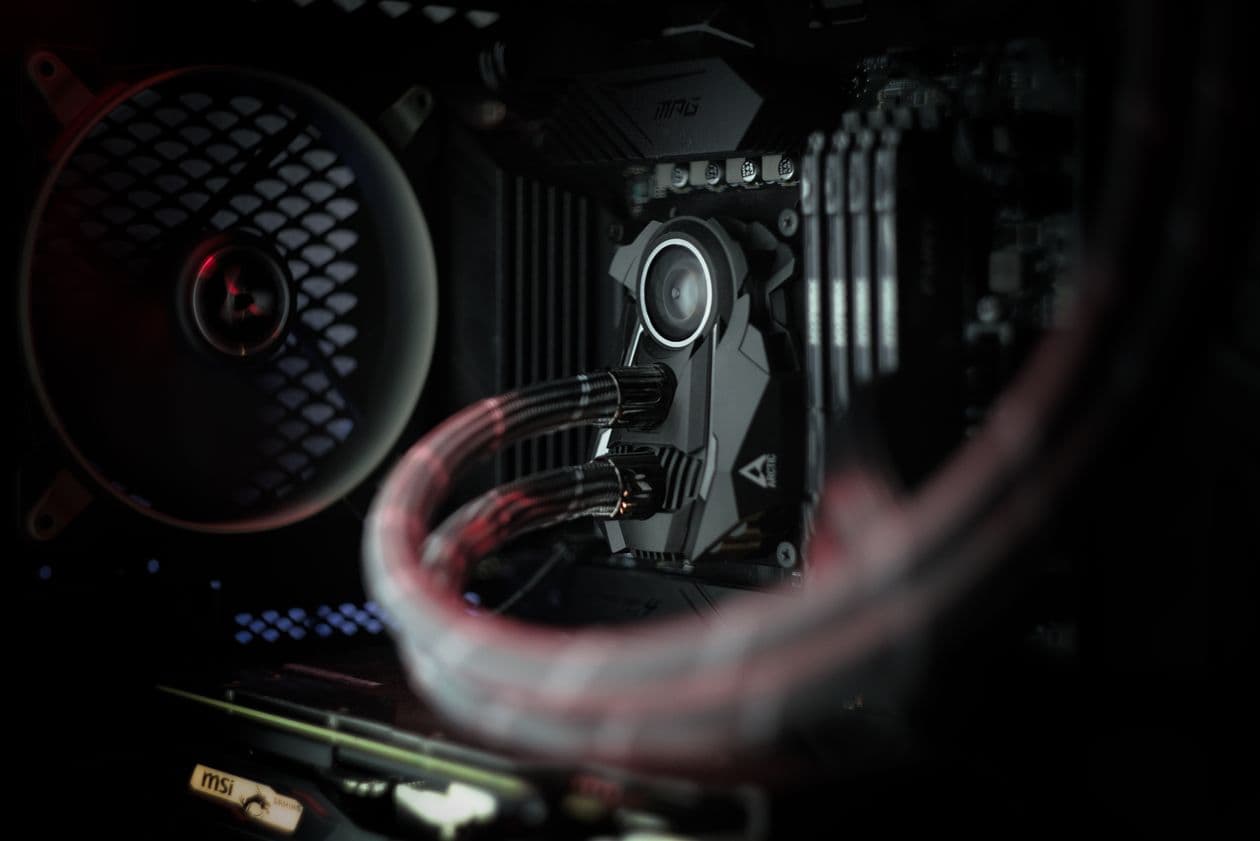 Interior of a gaming PC case with fans running addressable RGB lighting. RGB case fans add visual effect without changing cooling performance