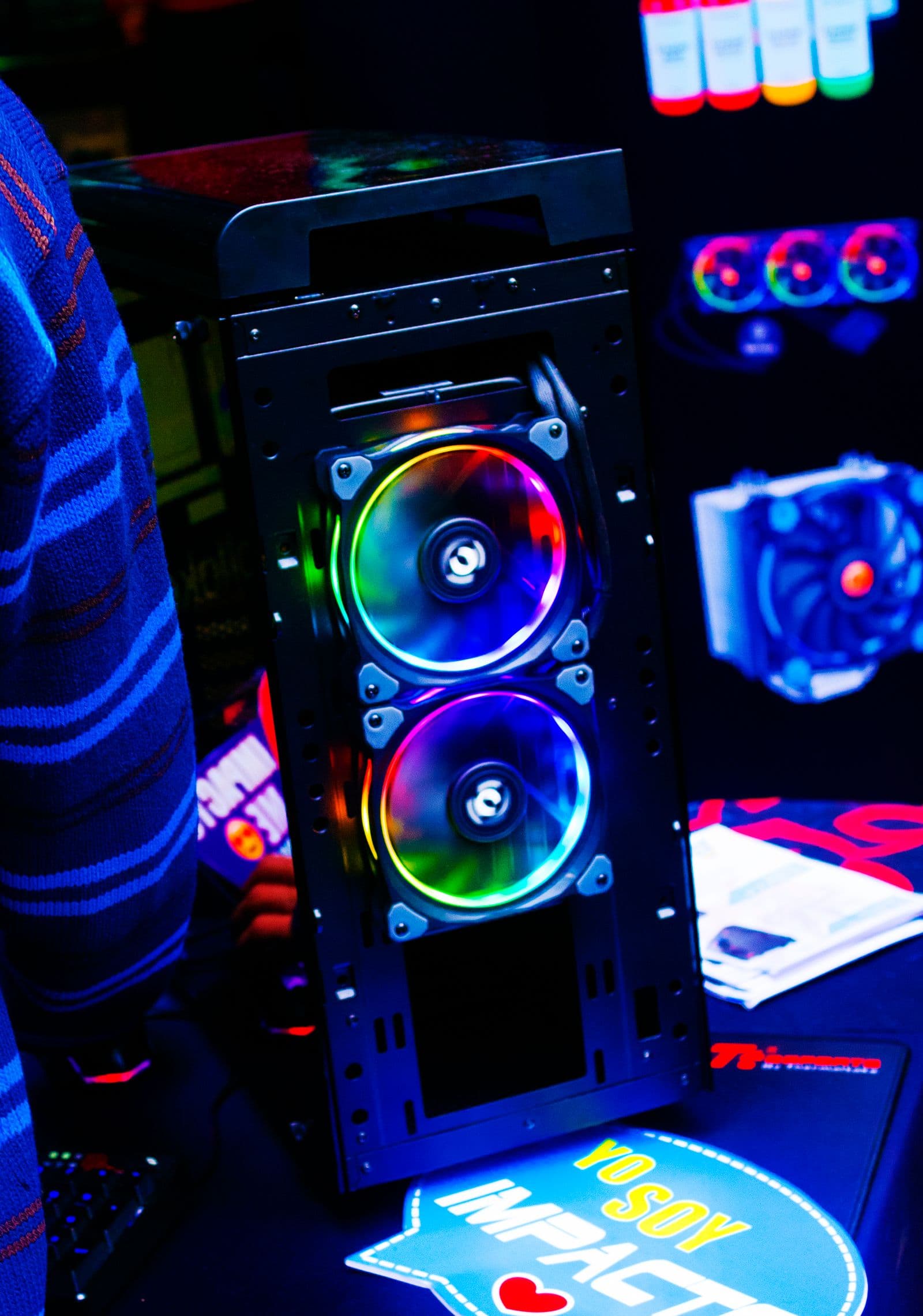 Close-up of a modern PC case with vibrant RGB LED fans
