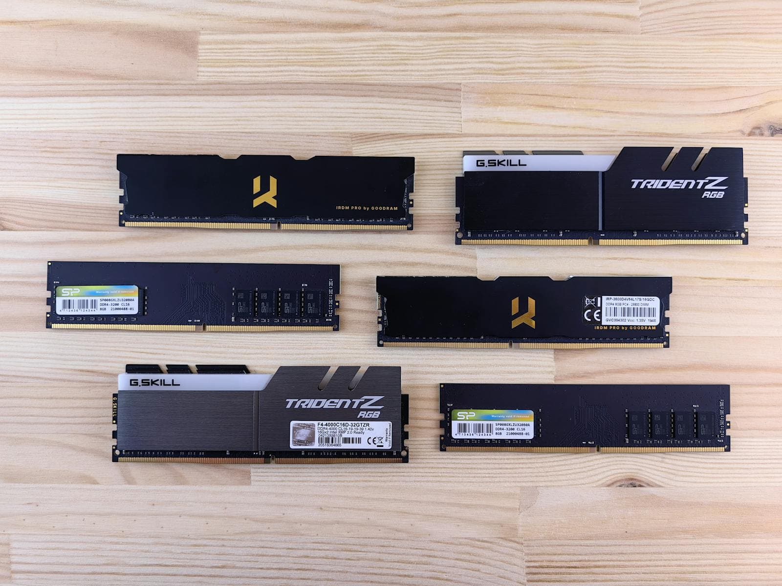 Multiple RAM modules of different generations laid out on a surface — DDR4 and DDR5 are physically incompatible; your motherboard determines which type you use