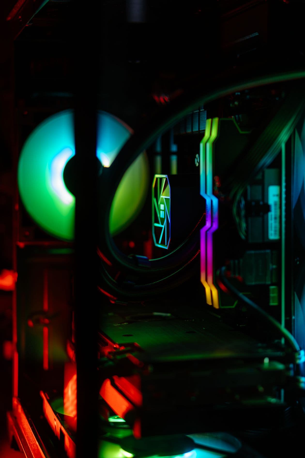 A custom RGB gaming PC interior showing fans and liquid cooling in a gaming build. Radiator positions require high-static-pressure fans rather than high-airflow fans