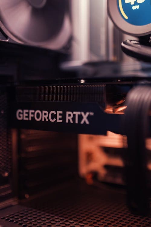 An NVIDIA GeForce RTX graphics card installed inside a PC case — at a budget build, the GPU receives 35–40% of total spend because it is the primary gaming performance driver
